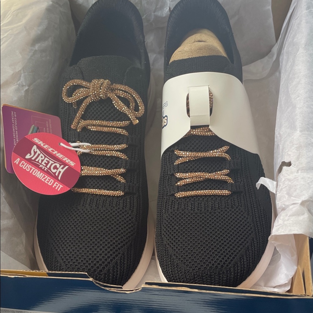Brand new. Never worn. 
Black with light cream sole
rose gold glittery laces
